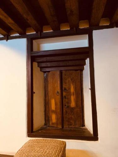 a wooden window on a wall in a room at Traditional Nepali Style 1 & 2 BHK Apartments, Humble Home, Patan in Pātan