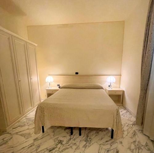 Postel nebo postele na pokoji v ubytování Hotel Coluccini