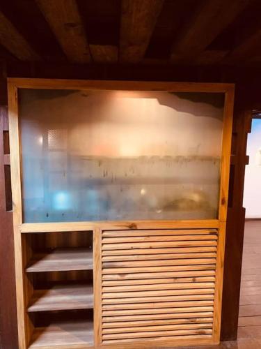 a wooden cabinet with a fish in it at Traditional Nepali Style 2 BHK Apartments, Humble Home, Patan in Pātan