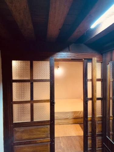 a room with a bunk bed in a room at Traditional Nepali Style 2 BHK Apartments, Humble Home, Patan in Pātan