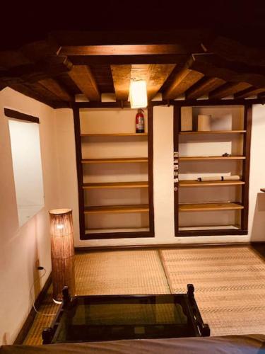 a room with a large room with at Traditional Nepali Style 2 BHK Apartments, Humble Home, Patan in Pātan