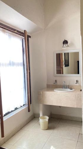 a bathroom with a sink and a mirror at Mansion Serrano Hotel in El Fuerte