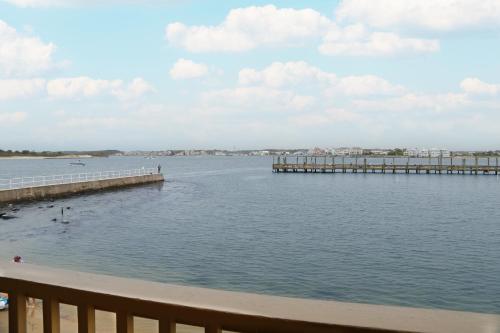 a large body of water with a pier at Oceanic Motel in Ocean City