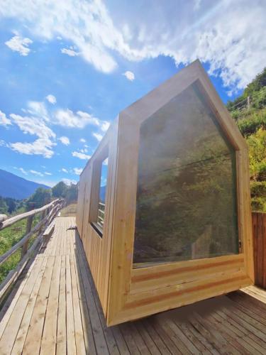 a large wooden box sitting on a wooden deck at Suite Etoile in Villa Dalegno