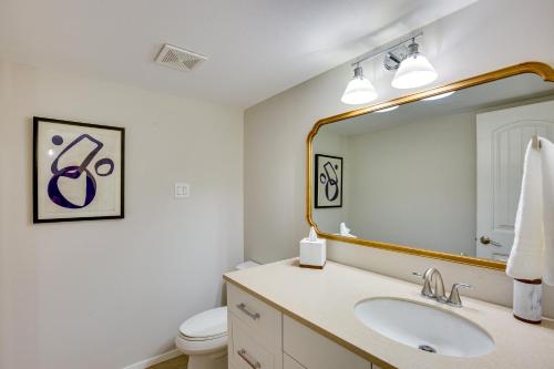 a bathroom with a sink and a mirror at Cedar Creek Lake Views Gorgeous Mabank House! in Mabank
