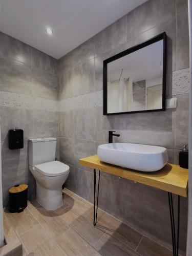 a bathroom with a sink and a toilet at Baloo Hostel in Athens