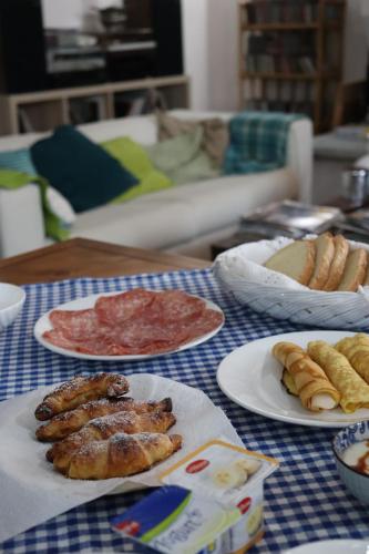 a table topped with plates of food on a table at GABRY GUEST HOUSE in Bruno