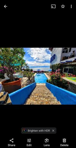 a screenshot of a picture of a swimming pool at Villas Jardin Del Mar in Cruz de Huanacaxtle