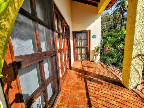 an entrance to a house with a wooden door at Villas Jardin Del Mar in Cruz de Huanacaxtle