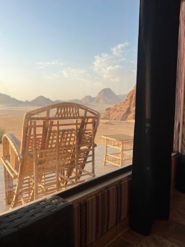 a view of the desert from a window at Wadi Rum Mars Camp in Wadi Rum