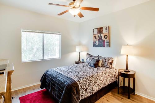 a bedroom with a bed and a ceiling fan at Tranquil Scottsdale Condo with Community Pool! in Scottsdale