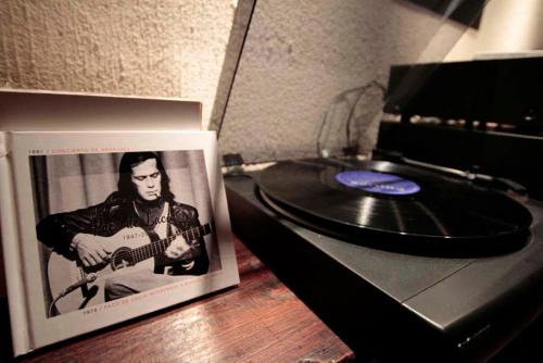 a cd with a picture of a man playing a guitar at Entre Dos Aguas Hotel Boutique in Toledo