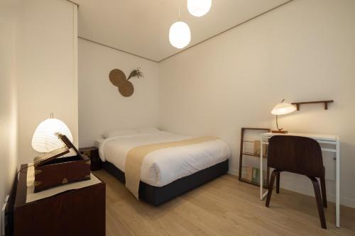 Postel nebo postele na pokoji v ubytování 3F Modern Hanok