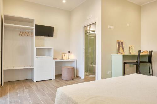 En eller flere senge i et værelse på Casa Chiari