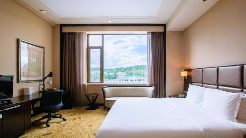 Postel nebo postele na pokoji v ubytování Holiday Inn Mudanjiang by IHG