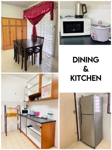 a kitchen with a table and a microwave and a refrigerator at Sofea Homestay Ipoh in Ipoh