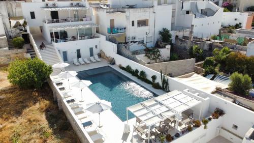 an aerial view of a house with a swimming pool at Zahra Superior Suite with private pool in Sannicola