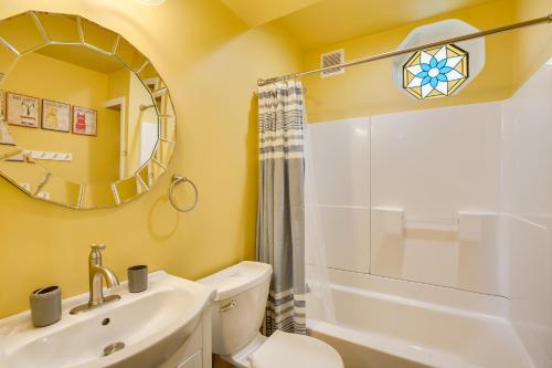 een badkamer met een wastafel, een toilet en een spiegel bij Spacious Jersey Shore Getaway Walk to Beach! in Wildwood