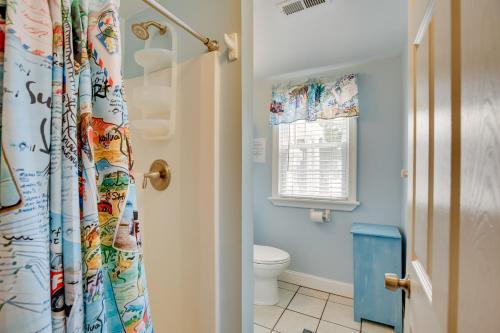 a bathroom with a toilet and a shower curtain at Jersey Shore Retreat Near Wildwood Boardwalk! in Wildwood