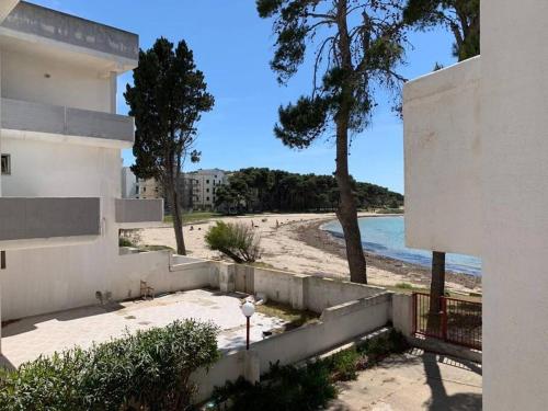 a view of a beach from a house at Le Giraffe ( n.CIS LE07503191000035725) in Rivabella