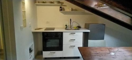 a kitchen with a sink and a stove at Freetime Trieste in Trieste