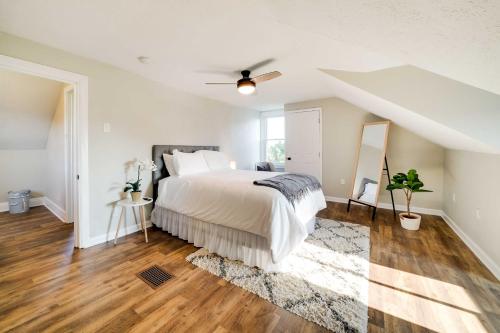 a bedroom with a bed and a ceiling fan at Bright Pittsburgh Apt, Walk to Grandview Ave! in Pittsburgh