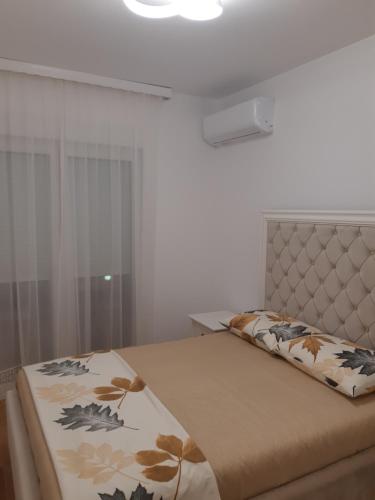 Postel nebo postele na pokoji v ubytování Apartman Arijela 2