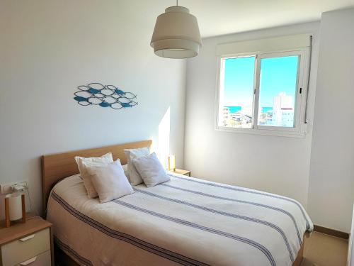 Katil atau katil-katil dalam bilik di PRECIOSO APARTAMENTO PLAYA DE PILES
