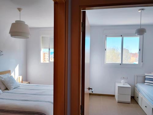 Katil atau katil-katil dalam bilik di PRECIOSO APARTAMENTO PLAYA DE PILES