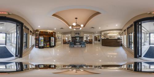 a large room with a lobby with windows at Sleep Inn Savannah Midtown in Savannah