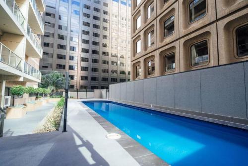 a swimming pool in the middle of a building at Serene on Grenfell Adelaide in Adelaide
