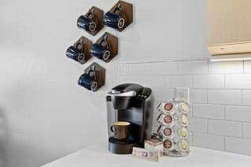 a coffee maker on top of a counter in a kitchen at Badger Den: 1mi.Snow College~ Wash/Dryer~Climb in Ephraim