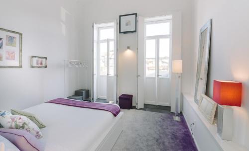 Oporto Welcome Apartments - Ribeira Negra tesisinde bir odada yatak veya yataklar