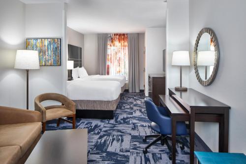 a hotel room with a bed and a desk at Fairfield Inn & Suites by Marriott Gainesville in Gainesville