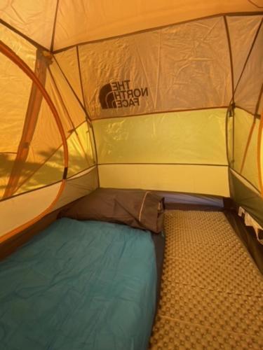 a small tent with the inside of it at Camping Yellow Plum in Puerto Natales