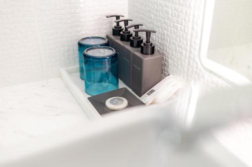 a bathroom with a sink with two water hydrants at Koh Chang Luxury Pool Villas in Ko Chang