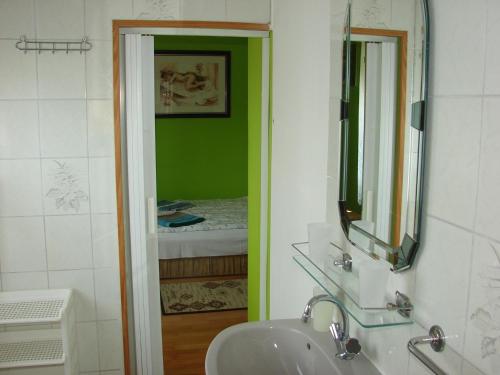 a bathroom with a sink and a mirror at Napfény villa in Balatonfüred