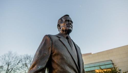 a statue of a man in a suit and tie at Staybridge Suites College Station by IHG in College Station