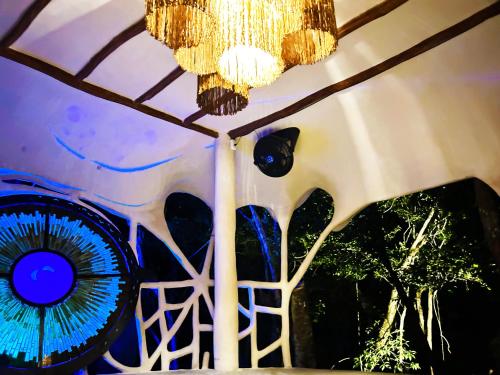 a chandelier hanging from the ceiling of a room at Ikalar in Akumal