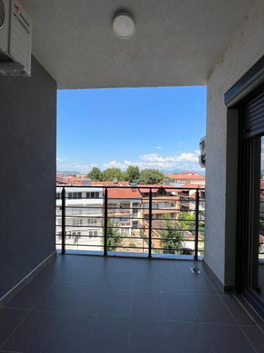 a large balcony with a view of a building at Apartment33 in Strumica