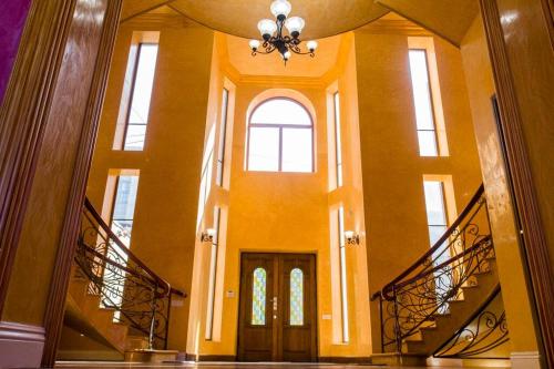a hallway with stairs and a door in a building at One-of-a-kind Home with a Million Dollar View in Yerevan