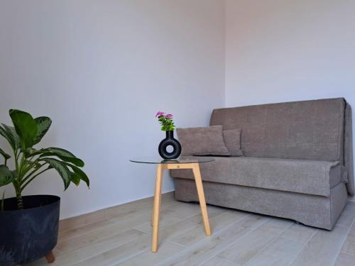 a living room with a couch and a table at Ida view in Hvar
