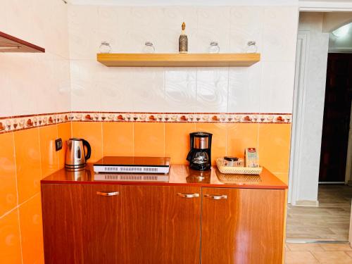 a kitchen with a counter with a coffee maker on it at Appartement Cosy quartier chic de Rabat in Rabat