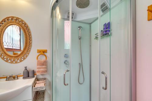 a bathroom with a shower and a sink at Cozy Santa Fe Getaway - Near Creek and Casinos in Pojoaque