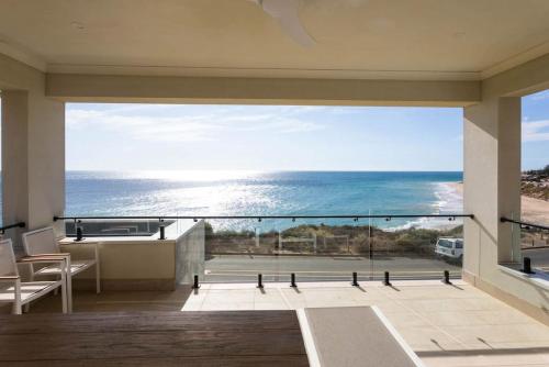a view of the ocean from the balcony of a house at Seascape Christies Ocean Views in Christies Beach