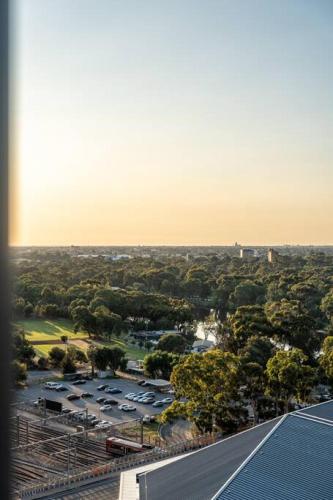 an aerial view of a parking lot with a train at The Views Penthouse Adelaide in Adelaide