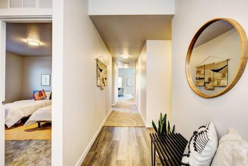 a bedroom and a hallway with a mirror at BRAND NEW 4-BDRM HOME Farmhouse at Grand Rapids in Meridian