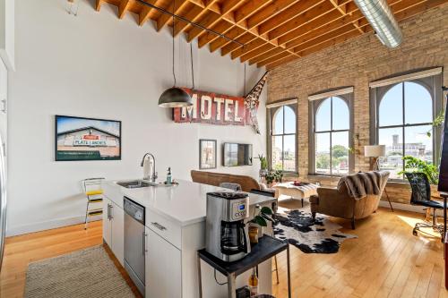 an open kitchen and living room in a loft at The Goatel - 1 bdrm apartment in Milwaukee