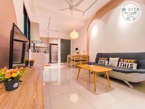 a living room with a couch and a table at Skudai Paradigm Mall by RR JBcity in Johor Bahru