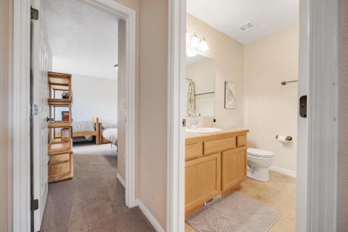 a bathroom with a sink and a toilet at Near Tamarack AC Kitchen TV Washer Dryer in Donnelly